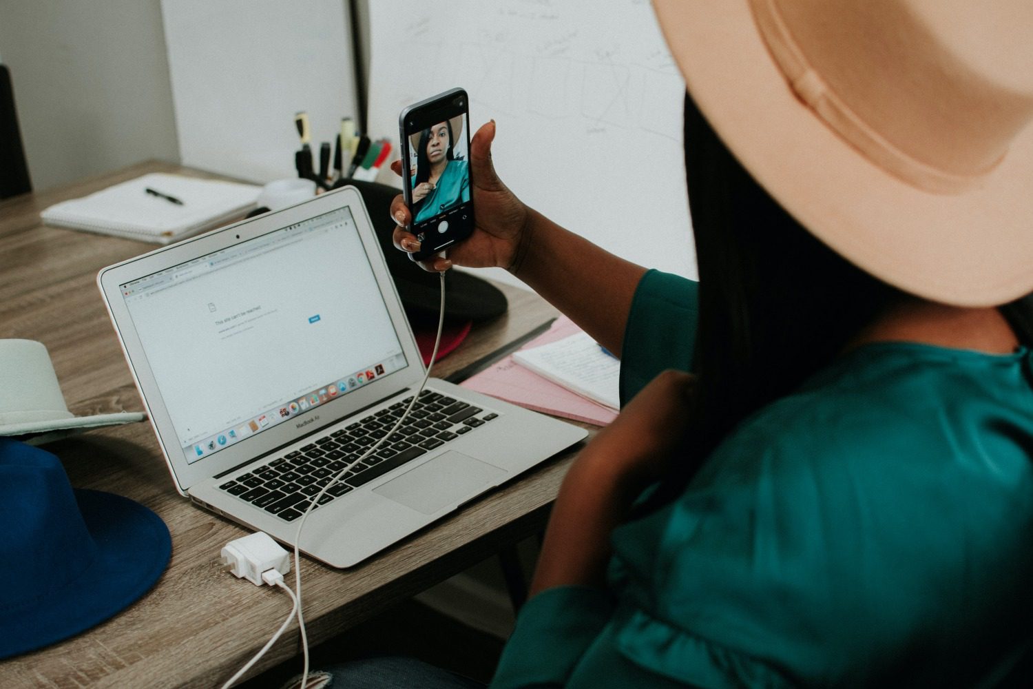 black woman laptop and cell phone